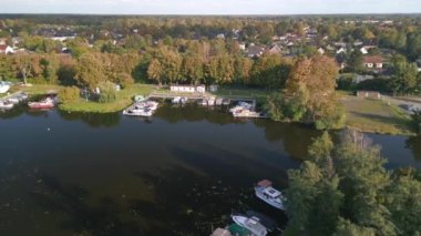 wide orbit overview drone river, Brieselang in brandenburg Germany at summer golden hour 2022. High Quality 4k Cinematic footage