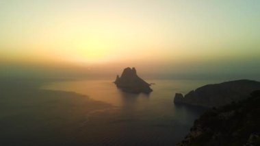 fly reverse drone Magic Sunset golden hour at ibiza es vedra island, autumn 2022. High Quality 4k Cinematic footage
