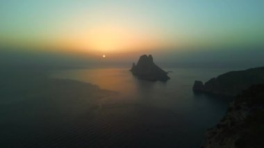 panorama overview drone Magic Sunset golden hour at ibiza es vedra island, autumn 2022. High Quality 4k Cinematic footage
