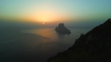 pull in drone Magic Sunset golden hour at ibiza es vedra island, autumn 2022. High Quality 4k Cinematic footage