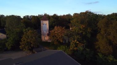 descending drone of Village church in Paretz Brandenburg Havelland Germany summer evening 2022. High Quality 4k Cinematic footage