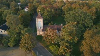 panorama overview drone of Village church in Paretz Brandenburg Havelland Germany summer evening 2022. High Quality 4k Cinematic footage