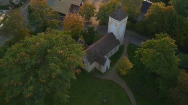 panorama orbit drone of Village church in Paretz Brandenburg Havelland Germany summer evening 2022. High Quality 4k Cinematic footage