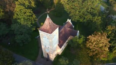 panorama orbit drone of Village church in Paretz Brandenburg Havelland Germany summer evening 2022. High Quality 4k Cinematic footage