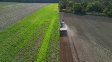 panorama overview drone tractor on fall field brandenburg havelland Germany at autumn 2022. High Quality 4k Cinematic footage