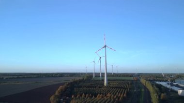 fly push in drone of a Wind farm wheel Field at Brandenburg Germany at autumn day 2022. High Quality 4k Cinematic footage
