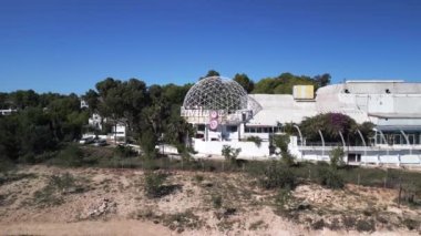 boom sliding to right drone disco club Privilege on party island ibiza spain, sunny summer day 2022. High Quality 4k Cinematic footage