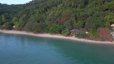 boom sliding to left drone white Sand Beach koh chang island Thailand, evening golden hour 2022. High Quality 4k Cinematic footage.