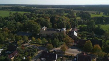 tracking shot from above drone of village ziethen castle in brandenburg germany, sunny summer day 2022. High Quality 4k Cinematic footage