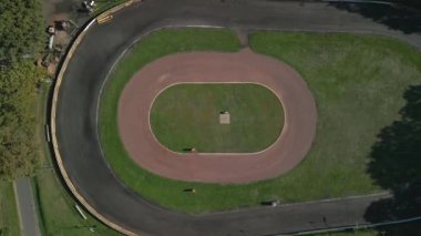 vertical birds eye view ascending drone ace track oval course germany, sunny summer day 2022. High Quality 4k Cinematic footage.