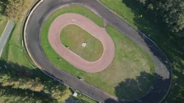 vertical birds eye view drone ace track oval course germany, sunny summer day 2022. High Quality 4k Cinematic footage.
