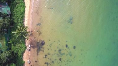 vertical birds eye view drone natural Beach at Koh chang island Thailand sunny day 2022. High Quality 4k Cinematic footage.