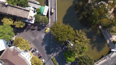 vertical birds eye view drone Bangkok river road bridge thailand, sunny day 2022. High Quality 4k Cinematic footage. 