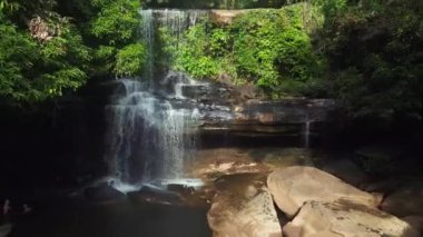 Great aerial view flight of Huang Nam Khiao Waterfall deep in the jungle on island ko kut thailand 2022. High Quality 4k Cinematic footage.