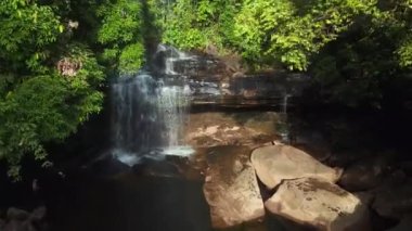 fly push in drone of Huang Nam Khiao Waterfall deep in the jungle on island ko kut thailand 2022. High Quality 4k Cinematic footage.