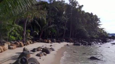 fly reverse drone of white beach koh kood island in thailand, day december 2022. High Quality 4K Cinematic Footage.