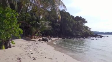 overflight fly over drone footage of white beach koh kood island in thailand, day december 2022. High Quality 4K Cinematic Footage.