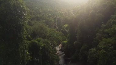 descending drone of Huang Nam Khiao Waterfall deep in the jungle on island ko kut thailand 2022. High Quality 4k Cinematic footage.