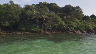 boom sliding to left drone of white beach koh kood island in thailand, day december 2022. High Quality 4K Cinematic Footage.