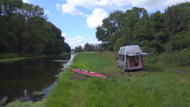 Red Paddle Boat Shoreline Caravan Camping Mobile Motorhome River Summer — Stock Video
