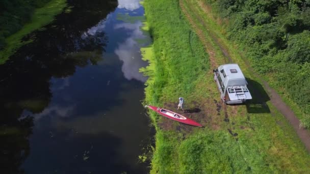 Red Paddle Boat Shoreline Caravan Camping Mobile Motorhome River Summer — Stock Video