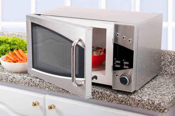 Microwave oven; photo in kitchen environment.
