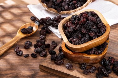 Healthy Food - Nuts Dehydrated Grapes; Photo On Wooden Background
