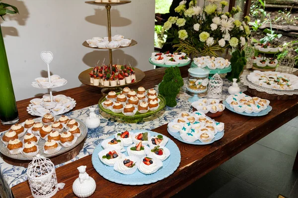 Reception Hall Decorated For Social Events; Dessert Table For Guests