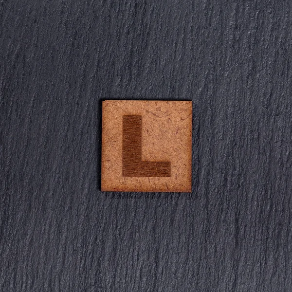 Square Wooden Tiles Letter Black Stone Background — 스톡 사진