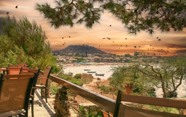 View of Stoupa town and beach at sunset, located in Messinia, Mani, Greece. 