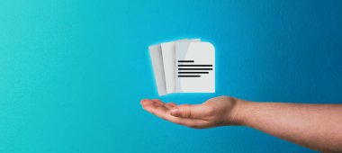 Banner of woman hand showing document icon with light blue background. Document Management System (DMS) concept. Process automation to efficiently manage files.