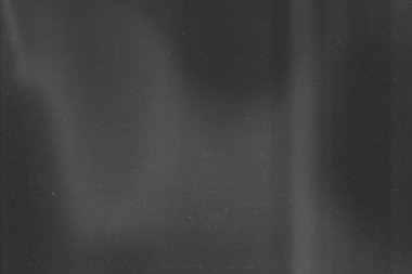 Abstract retro grunge decorative relief with film dust texture and black and white gradient colors. Rough colored illustration background.