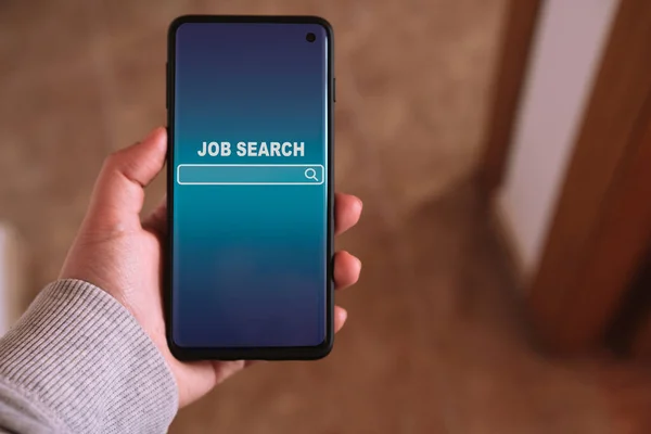 Woman using smartphone to find a job. Find your career. Online website on screen to search a job.