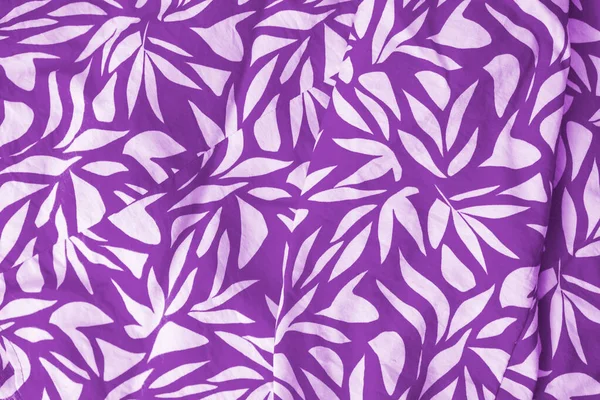 Purple floral cloth pattern for background and with copy space. Beautiful floral design on Lilac blouse textured. Vintage design. Close up photo. Summer vibes.