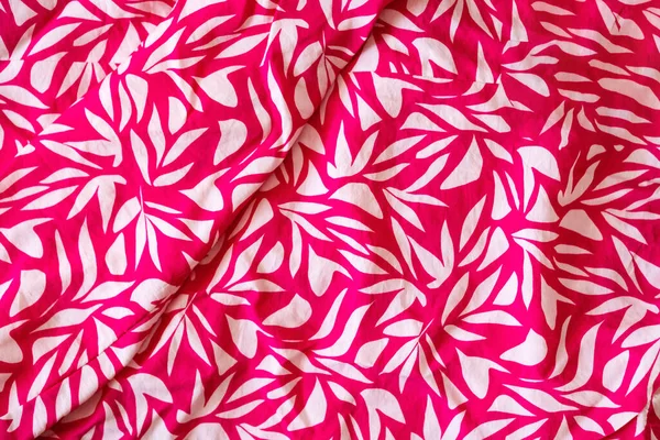 Magenta floral cloth pattern for background and with copy space. Beautiful floral design on magenta blouse textured. Vintage design. Close up photo. Summer vibes.