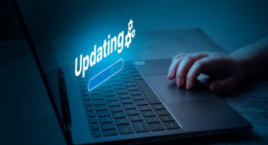 Woman updating software on laptop. System engineer and programming. Software apps developer.