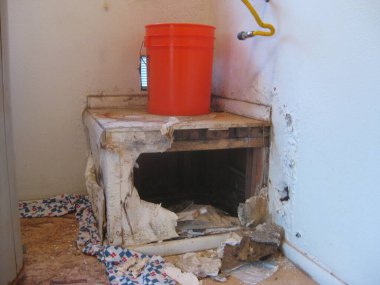 Water Damaged Gas Water Heater Stand Demo . High quality photo