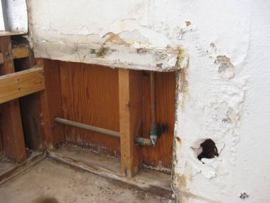 Fixing Water Damaged Drywall, Open Wall to Studs. High quality photo