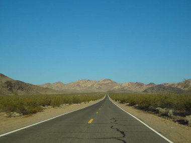 Lonely Highway to Death Valley National Park. High quality photo