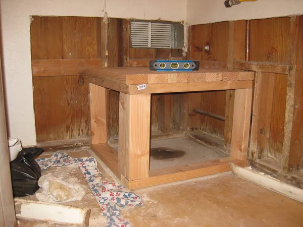 Level on Newly Built Wooden Water Heater Stand Frame . High quality photo