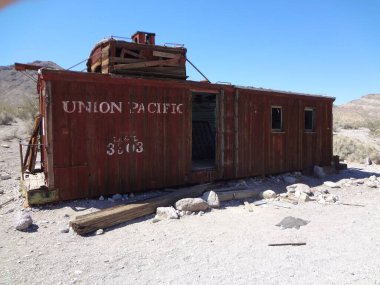 Old Red Caboose Deteriorating in Rhyolite Nevada Desert. High quality photo