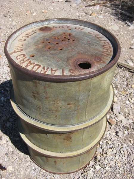 Green Rusty Old Oil Drum Barrel in Desert . High quality photo