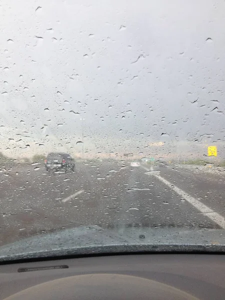 Rainy Windshield While Driving on the Highway. High quality photo