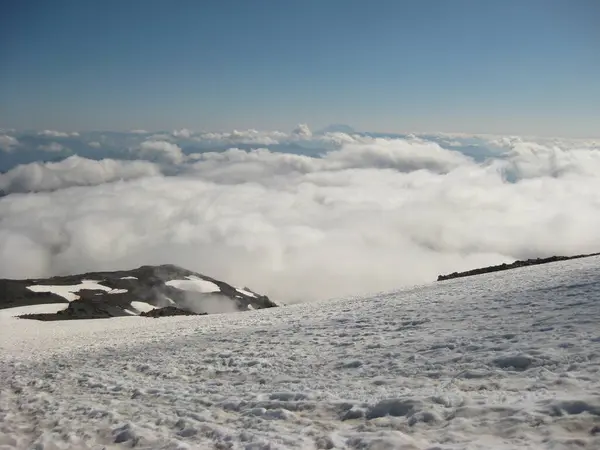 stock image Hiking Mount Rainier to Camp Muir, Snow Field, Skyline Loop Trail to Camp Muir Route. Mount Rainier National Park High quality photo