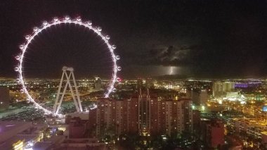 Lightning Striking on the Horizon, Las Vegas Strip Lights, Giant Wheel Ride . High quality photo clipart