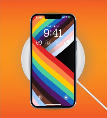 Cep telefonunun şarjı kablosuz şarjı bitiyor. Telefon ve şarj aleti turuncu arka plan.