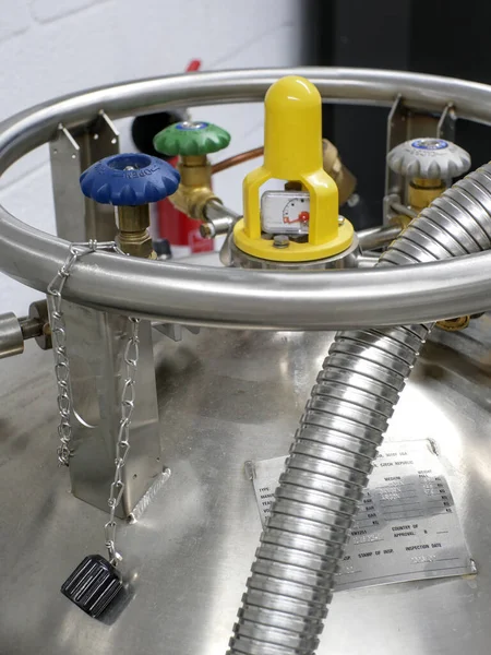 stock image Top view of a liquid nitrogen container with the pressure gauge and the different valves and pipes