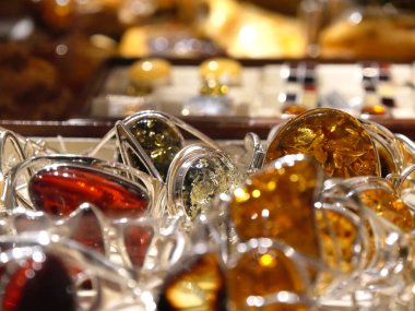 Amber jewelry on a wall in Sukiennice clothes hall in Krakow