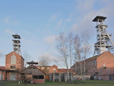 Wallers, France - 02 05 2023 : Wallers Arenberg mining site, with its red brick buildings and headframes. Site classified by UNESCO.