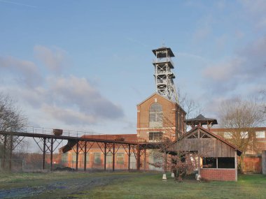 Wallers, France - 02 05 2023 : Wallers Arenberg mining site, with its red brick buildings and headframes. Site classified by UNESCO.